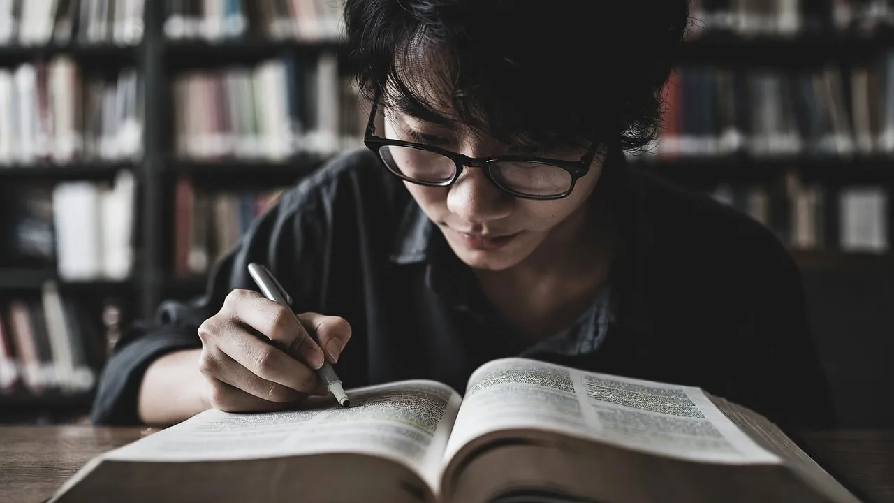 Advanced German student studying complex texts for TELC B2 certification